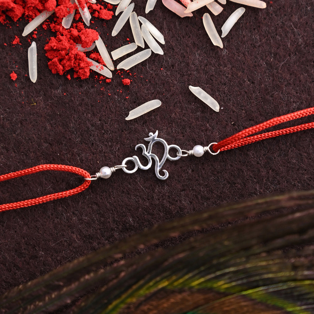 Silver Om Religious Rakhi with Roli Chawal for Bhai Brothers